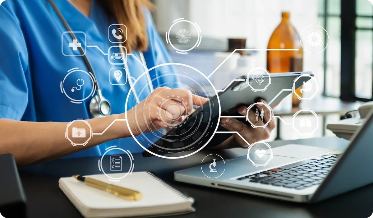 Closeup of nurse using tablet with medical related icons overlayed in front of the image