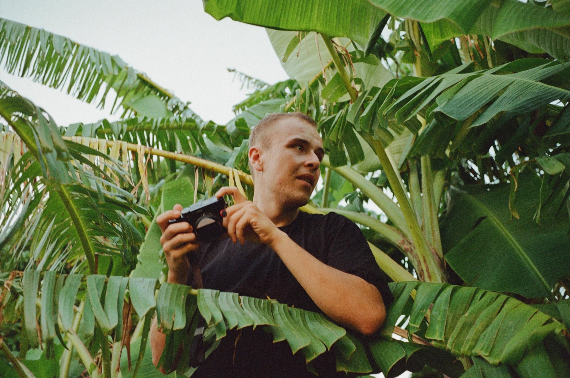 Josef Sindelka photographing among banana leaves