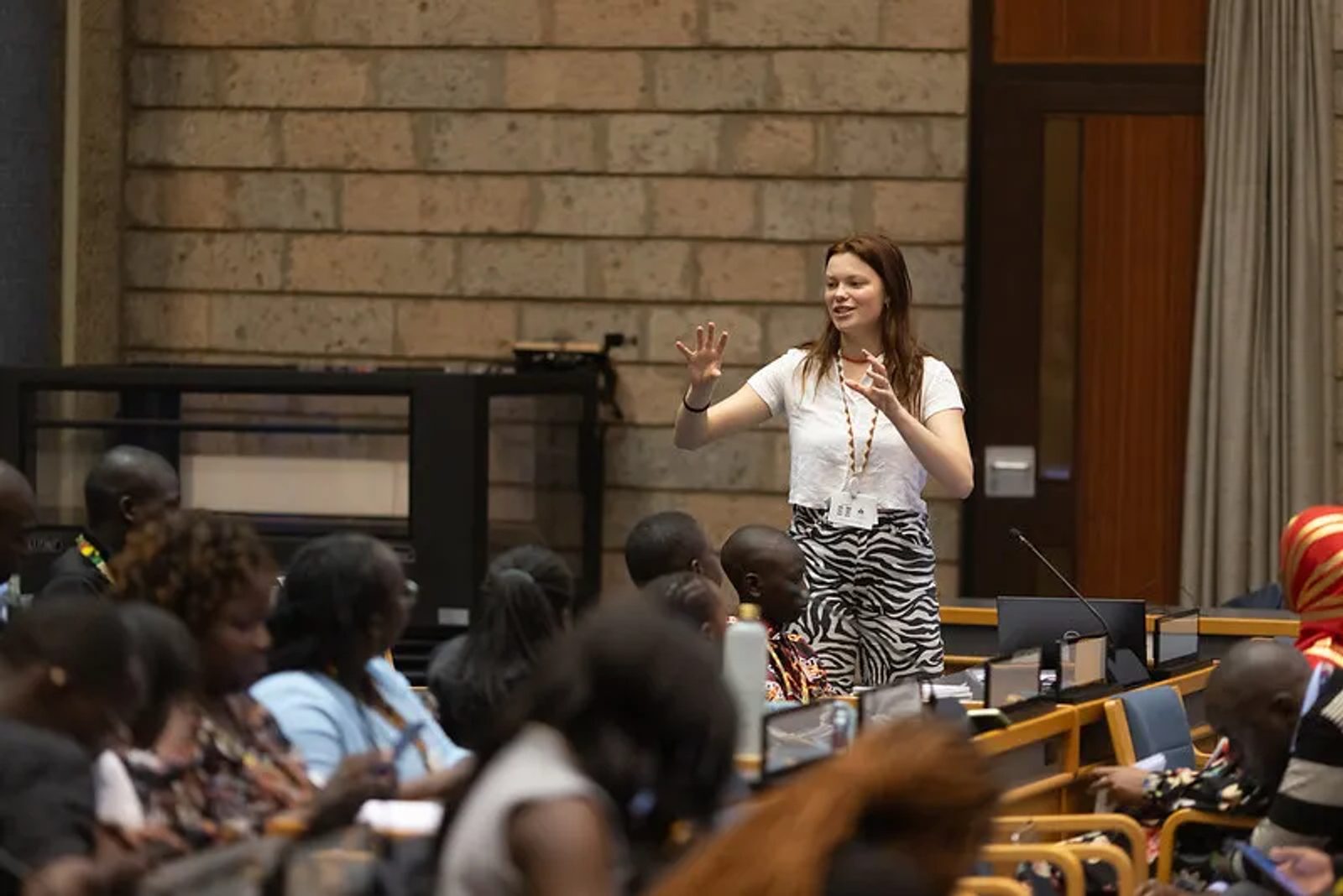 Youth delegates participating in a large assembly