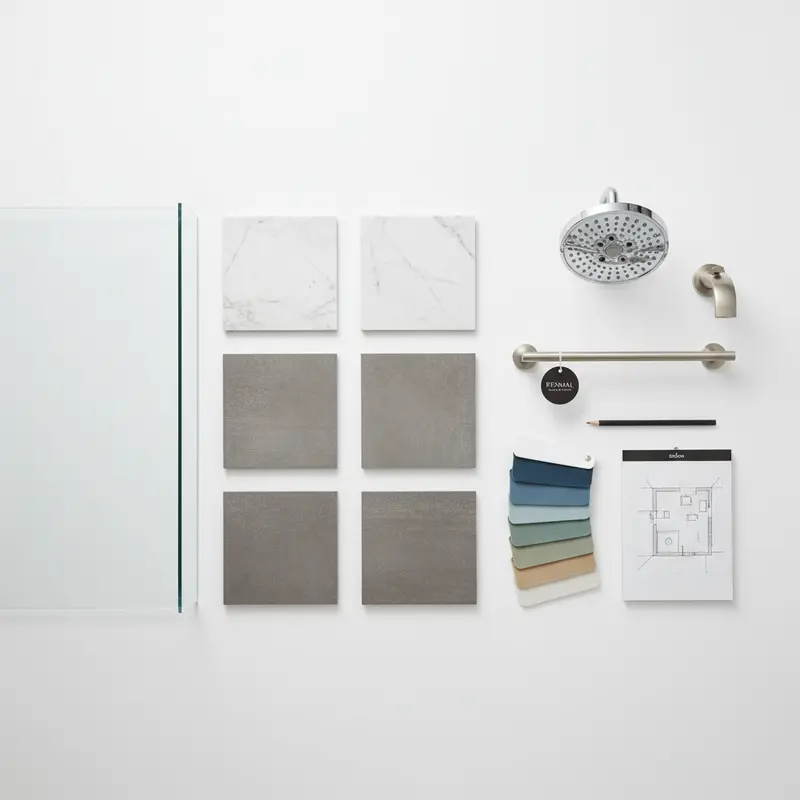 Bathroom renovation material samples including tile, glass, and fixture options for corner shower installations