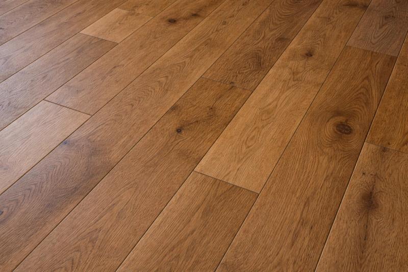 Premium wide-plank engineered hardwood flooring in warm oak installed in Roseville home remodel by Western Renovations