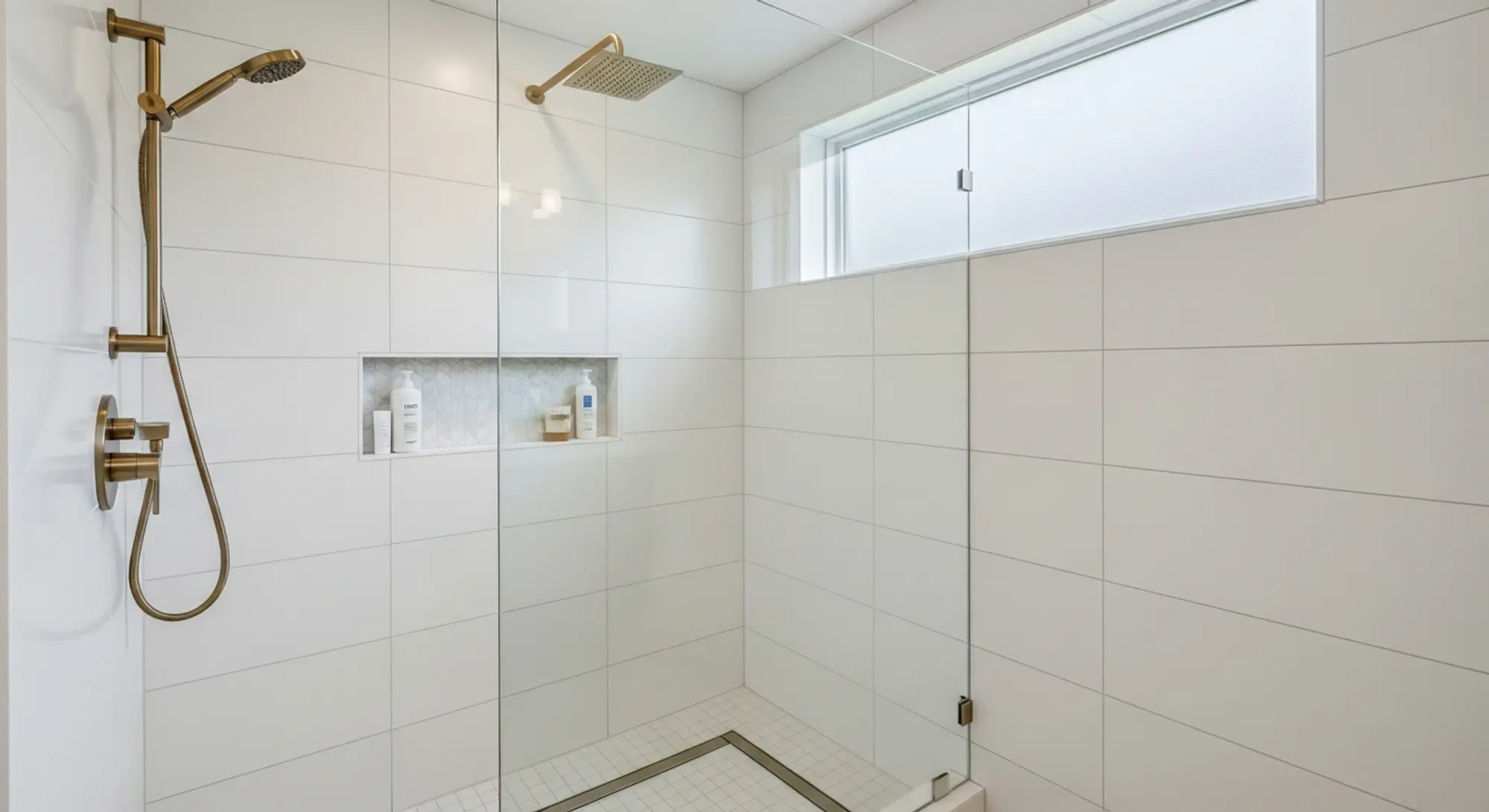 Modern walk-in shower with frameless glass and white tile in a Sacramento bathroom renovation by Western Renovations