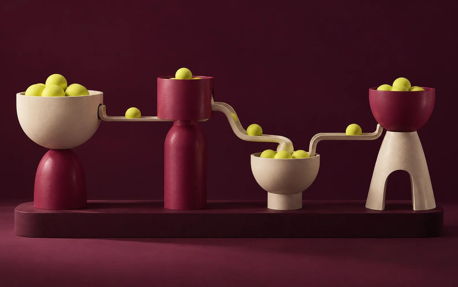 Four modular vessels hold yellow spheres connected by narrow channels.