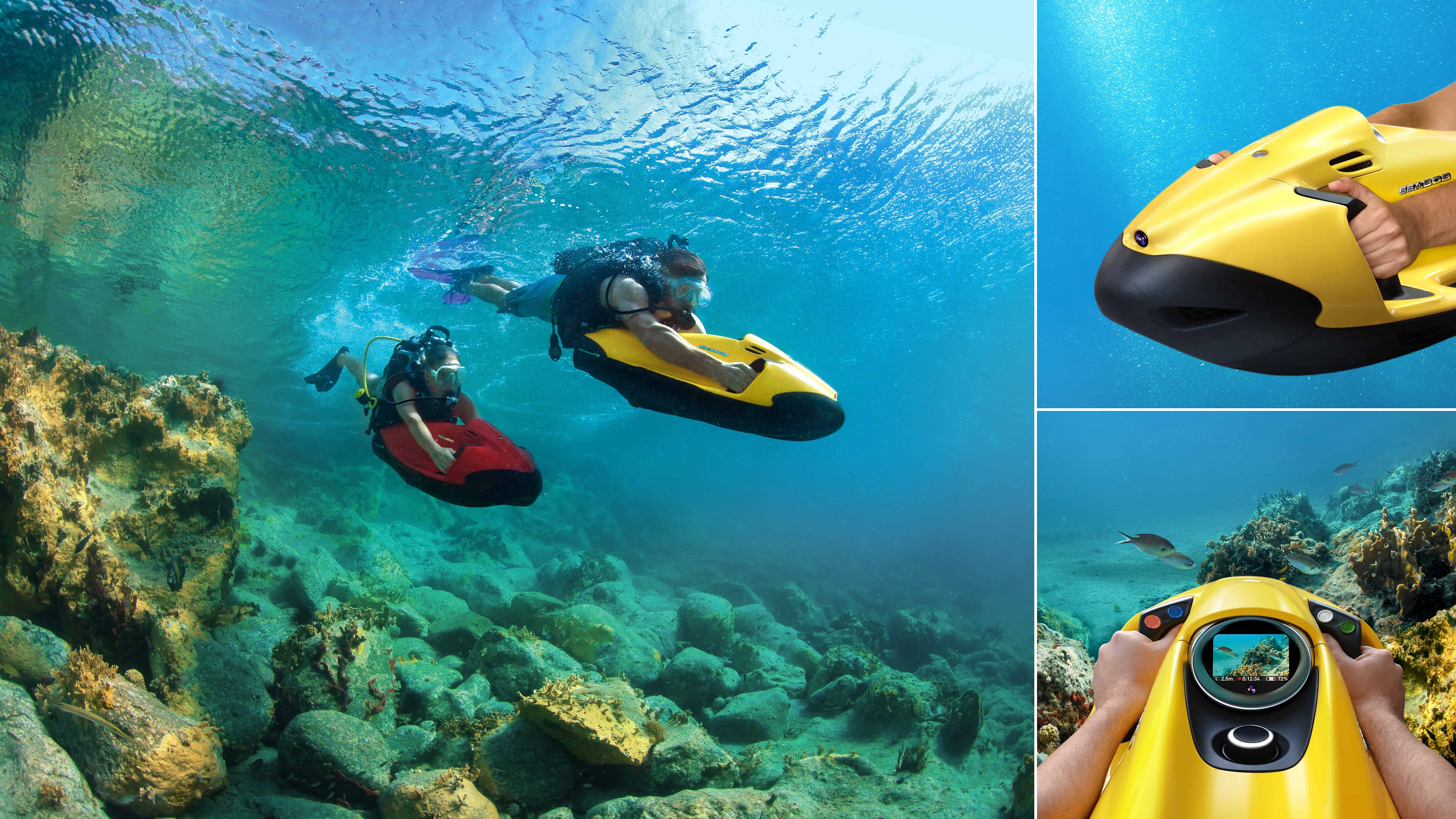 Two people diving under water using Seabobs