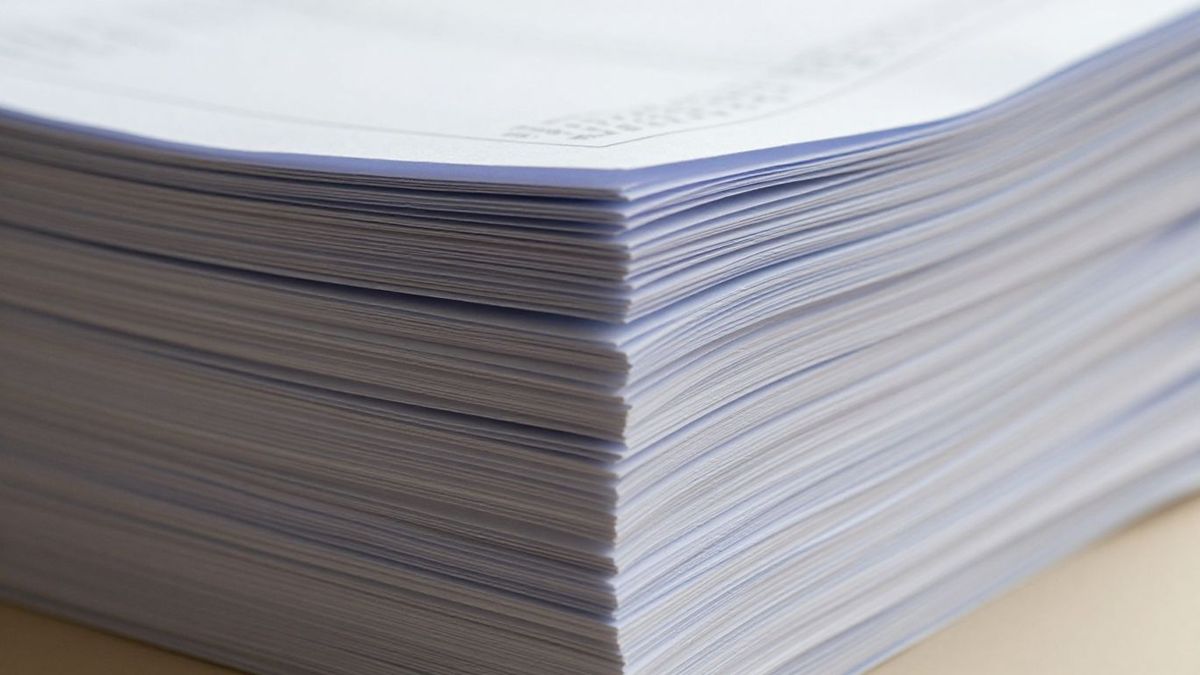 Stack of professional documents, conveying trust and evidence.