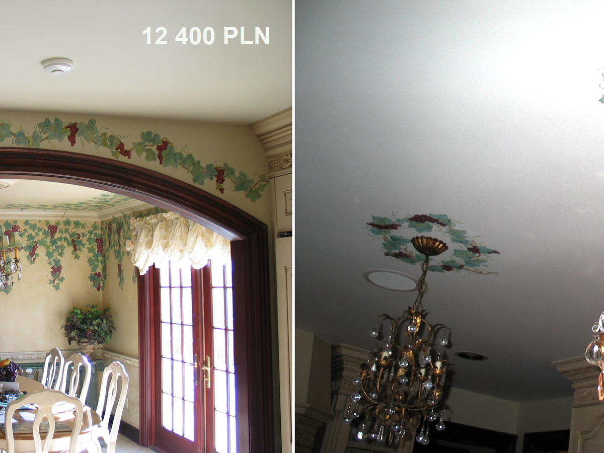 A view on a dinette with mural around the walls and around two chandeliers. Grape leaves on walls and ceiling in a dining room