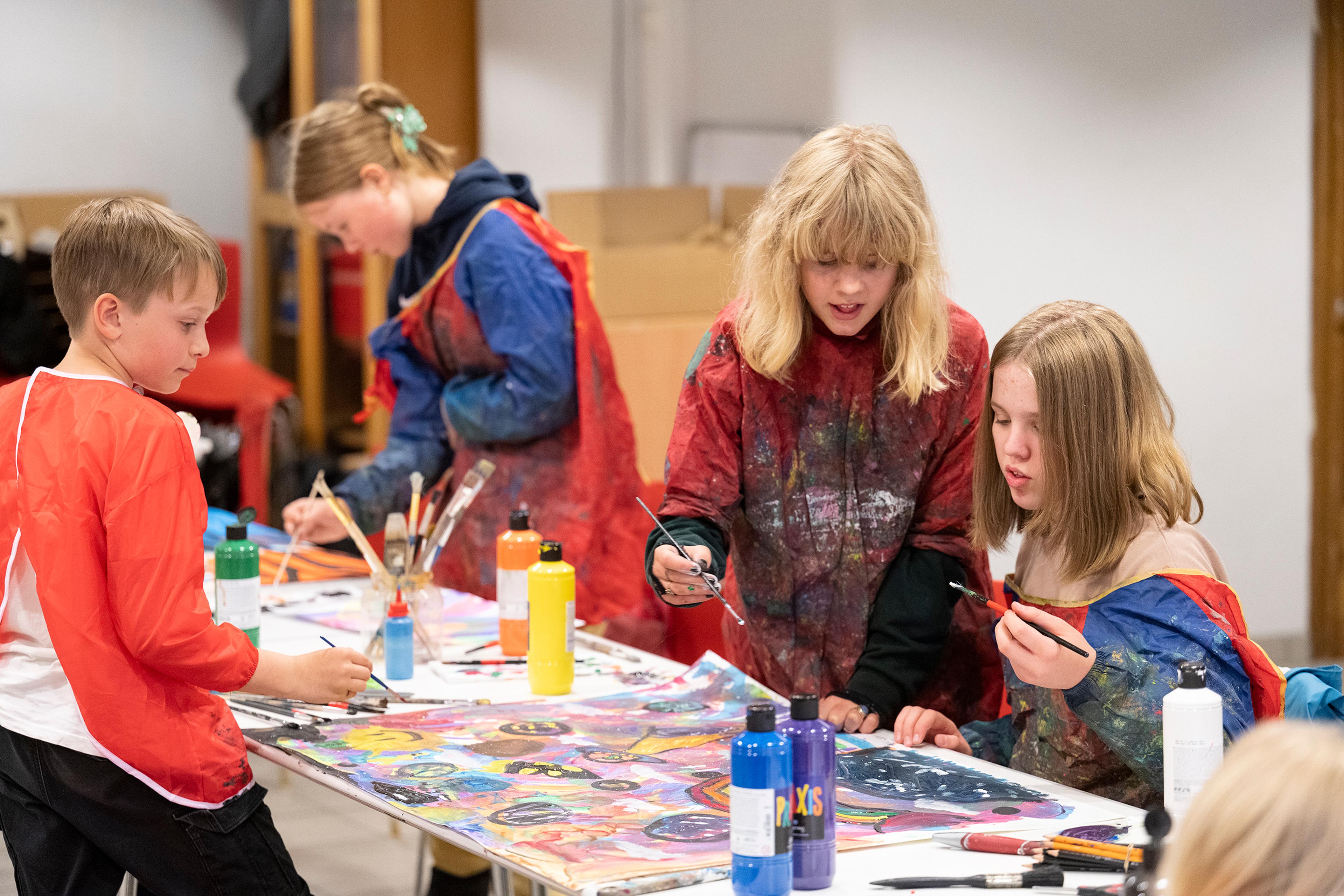 A group of children in one of our studios, painting.