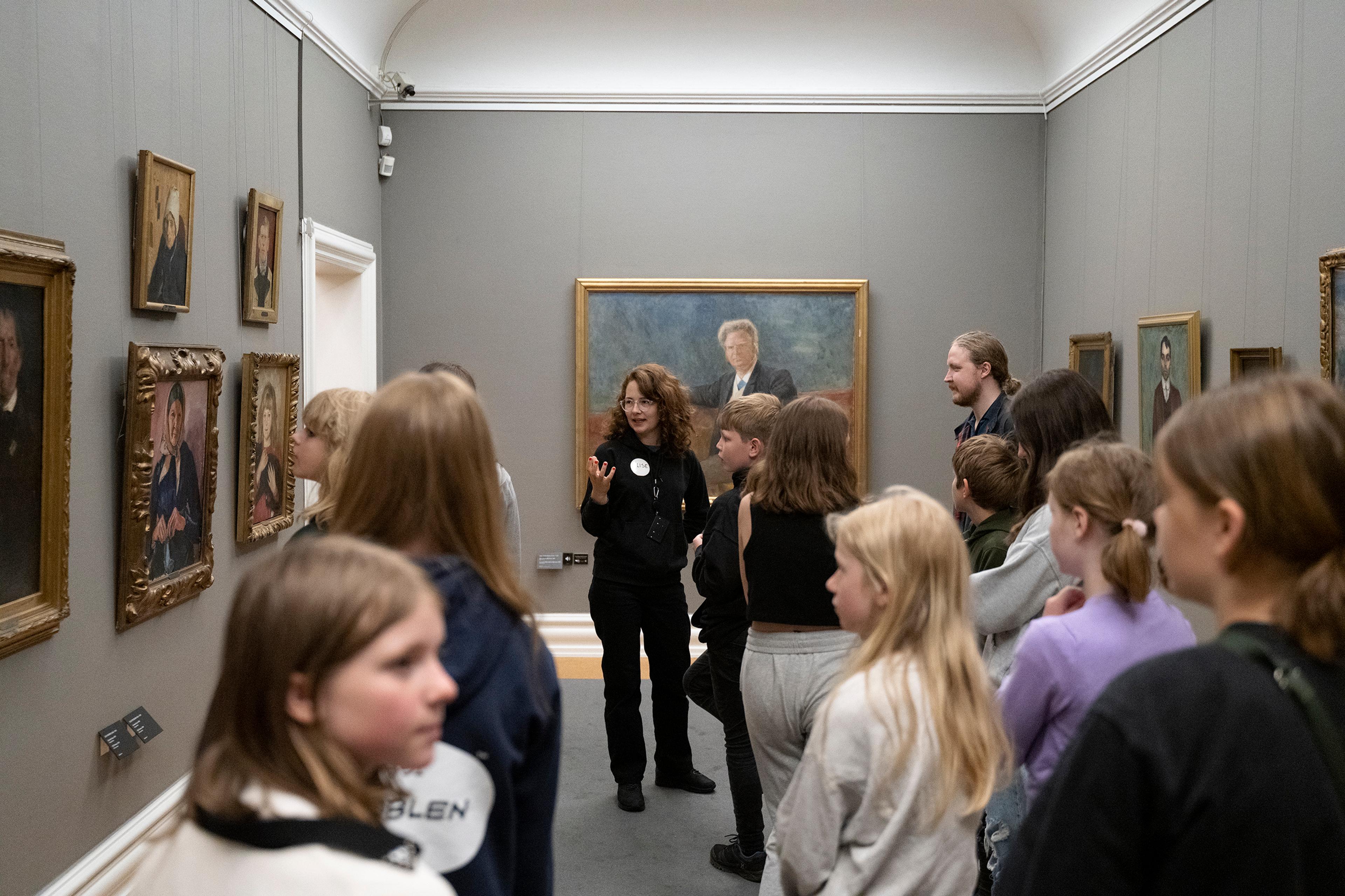 A group of children on a guided tour of Rasmus Meyer