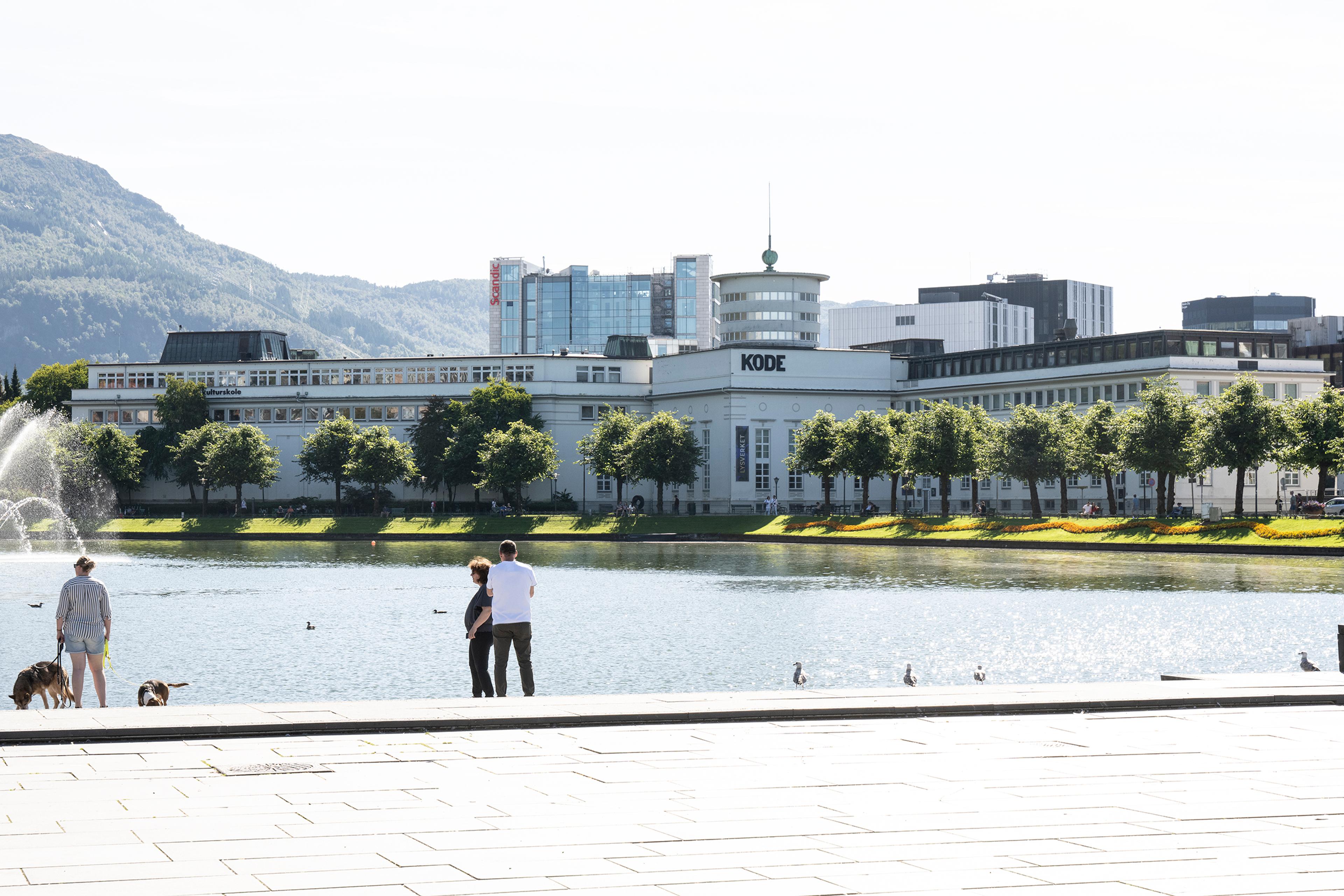 The Lysverket museum in the background of the city lake. It is summer.