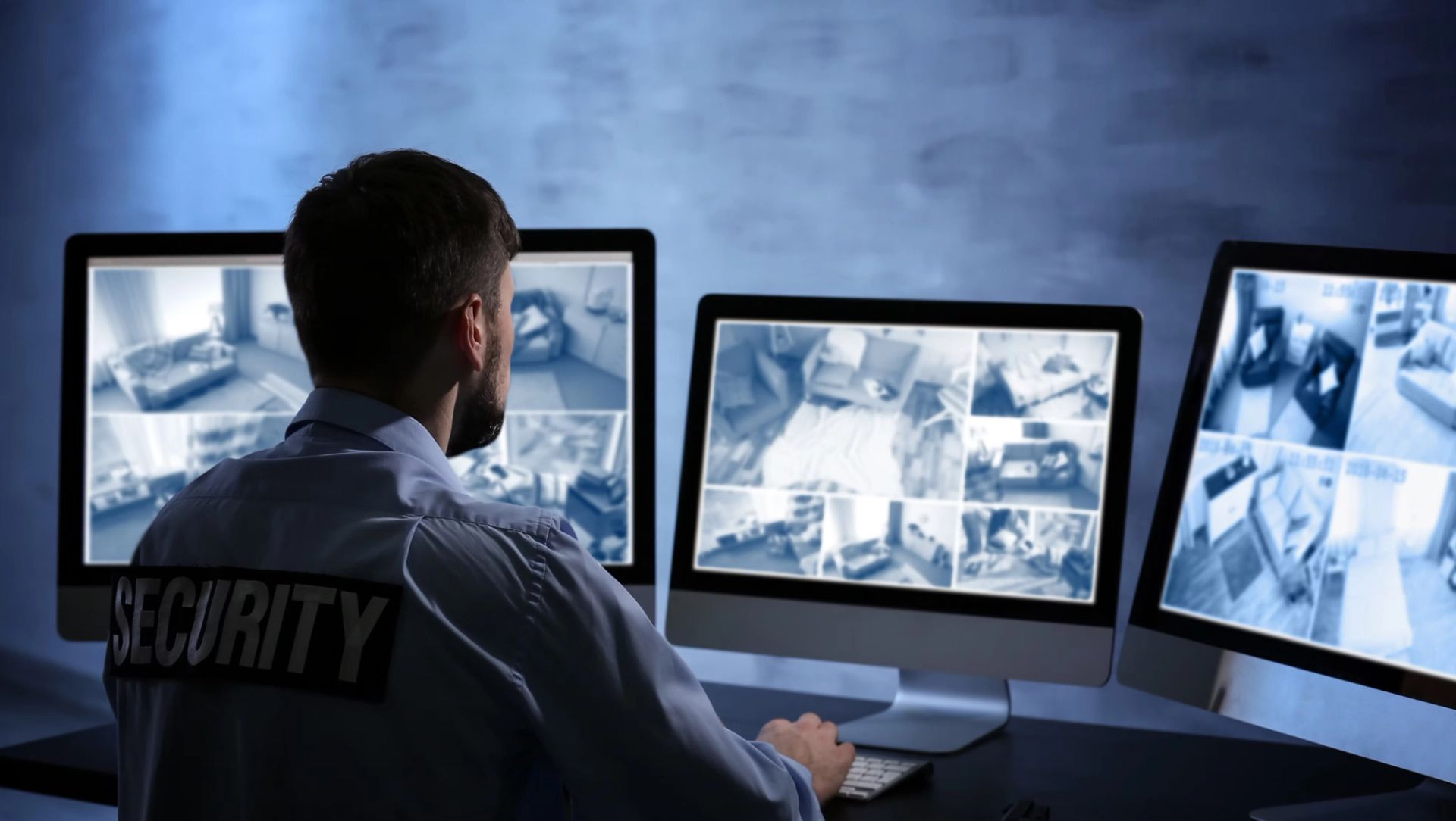 man monitoring cameras