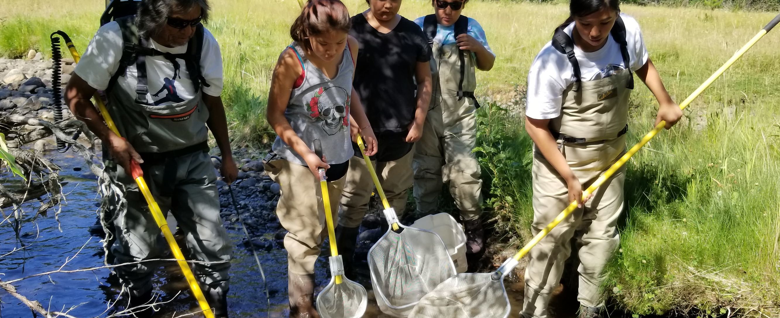 Children doing research in a creek