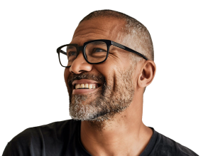 Image of man wearing glasses and smiling, looking to his right