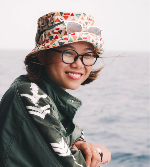 Woman with glasses and hat.png