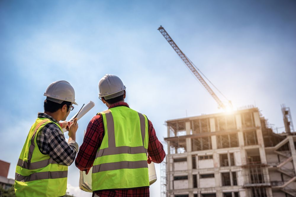 Inspector reviewing a construction permit in the field