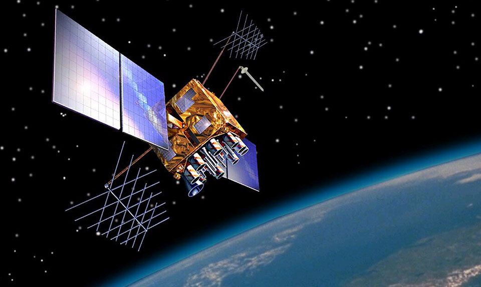 An artist’s impression of a GPS satellite in orbit above the earth