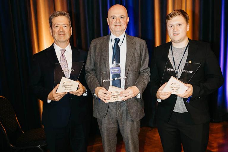 Joe Quirk, Massimo Mazzone and Mitchell Suchner holding their awards on stage at the Free Cities Conference 2025 in Prague