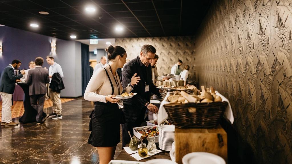 Premium ticket holders serving themselves at the buffet lunch at Empire Hall during the Liberty in Our Lifetime conference
