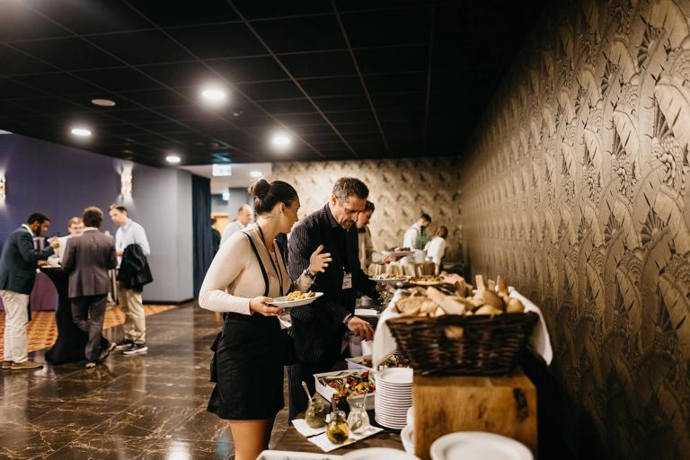 Attendees serving themselves from the buffet at the Free Cities Conference premium lunch