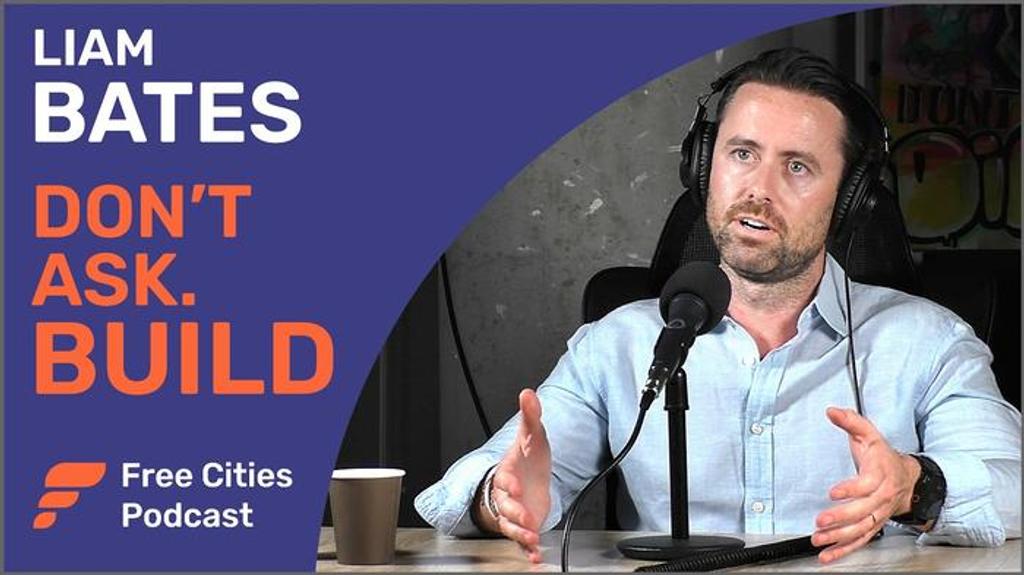 Free Cities Podcast cover with Liam Bates of Sealand speaking at a microphone, titled Don't Ask. Build