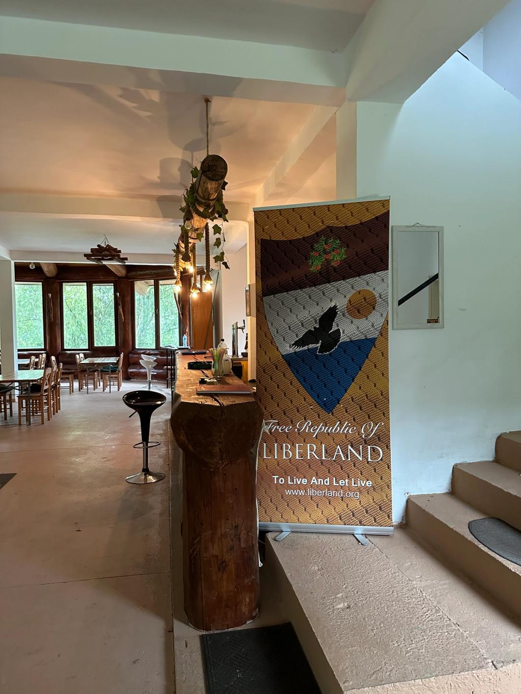 Free Republic of Liberland roll-up banner inside Ark Village, Serbia, seat of the Liberland government in exile
