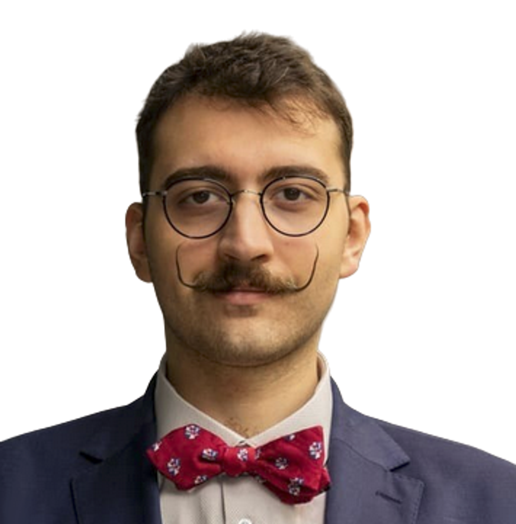 Portrait of entrepreneur and Bitcoin evangelist Andreas Kohl wearing glasses and a red bow tie