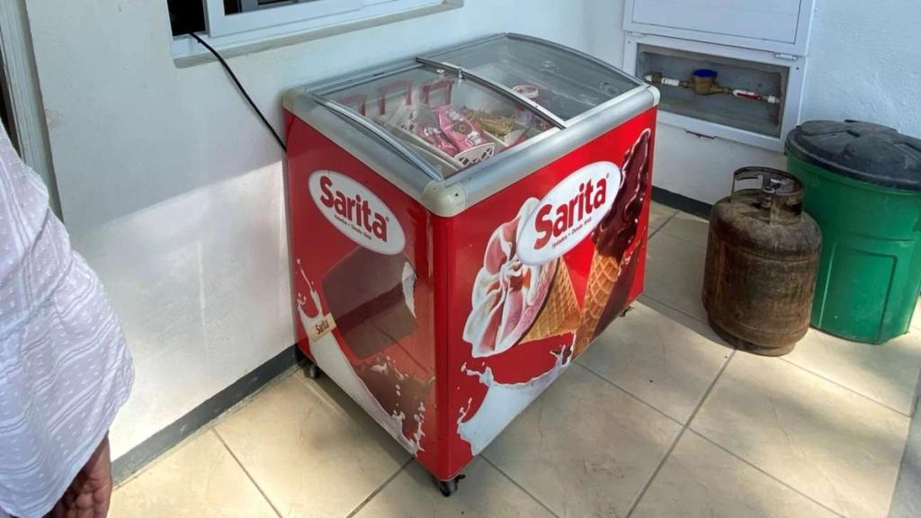 Red Sarita ice cream chest freezer in Rosa's convenience store in Ciudad Morazán