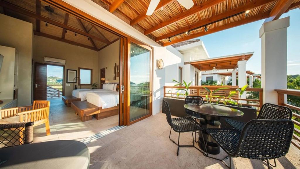 Bedroom and shaded terrace of Las Verandas, luxury accommodation in Próspera, Roatán