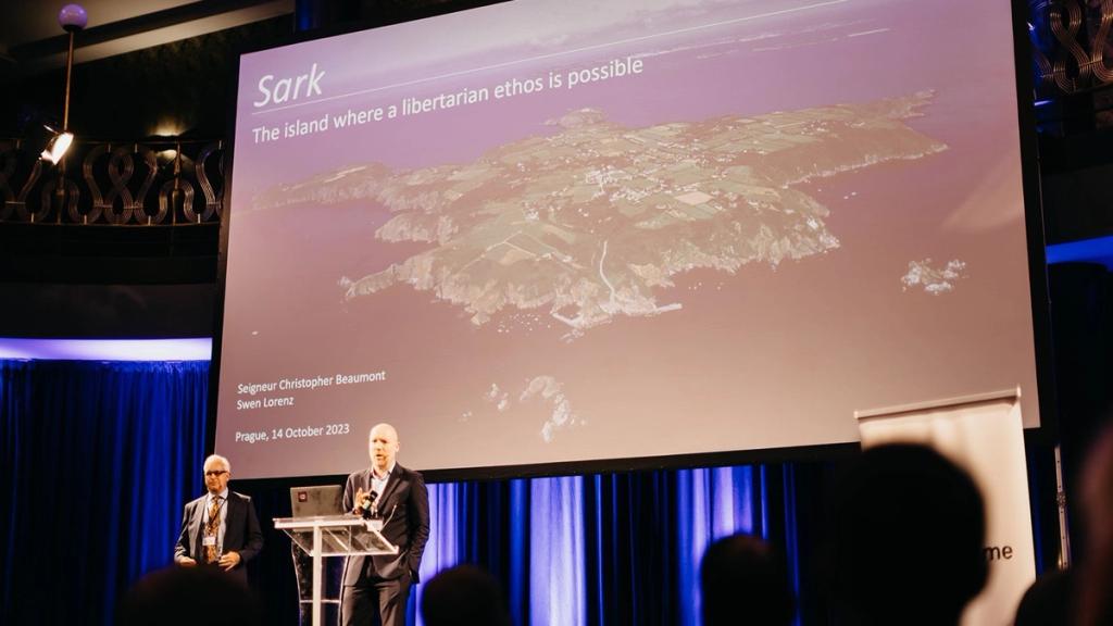 Swen Lorenz and Seigneur Christopher Beaumont presenting on Sark at Liberty in Our Lifetime 2023 in Prague