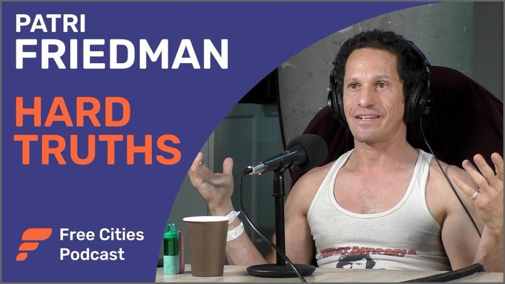 Free Cities Podcast thumbnail reading Patri Friedman Hard Truths, showing Friedman speaking into a microphone in headphones