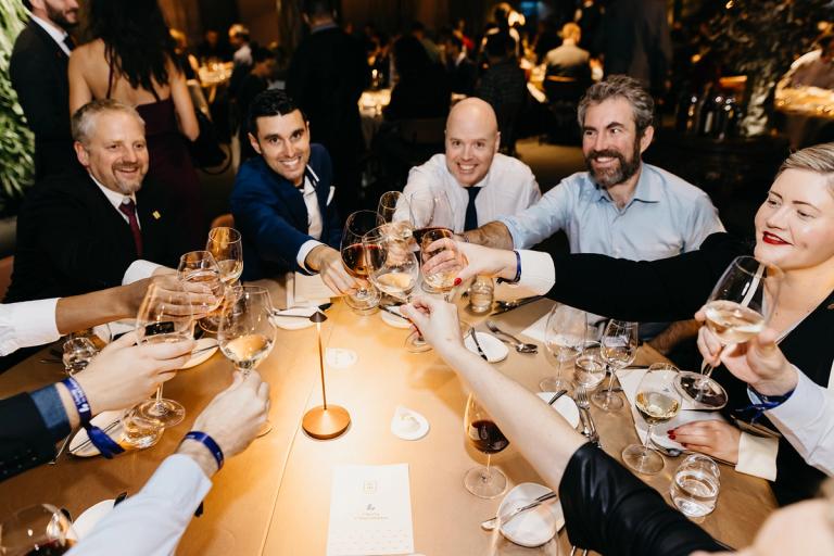 Guests raising a toast at the Free Cities Conference VIP dinner