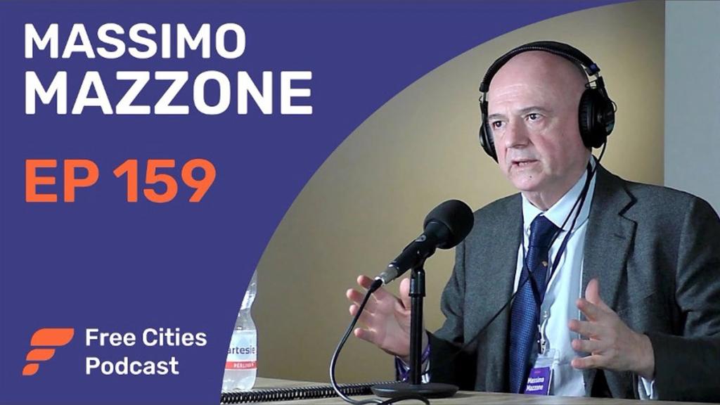 Free Cities Podcast episode 159 cover with Massimo Mazzone speaking into a microphone