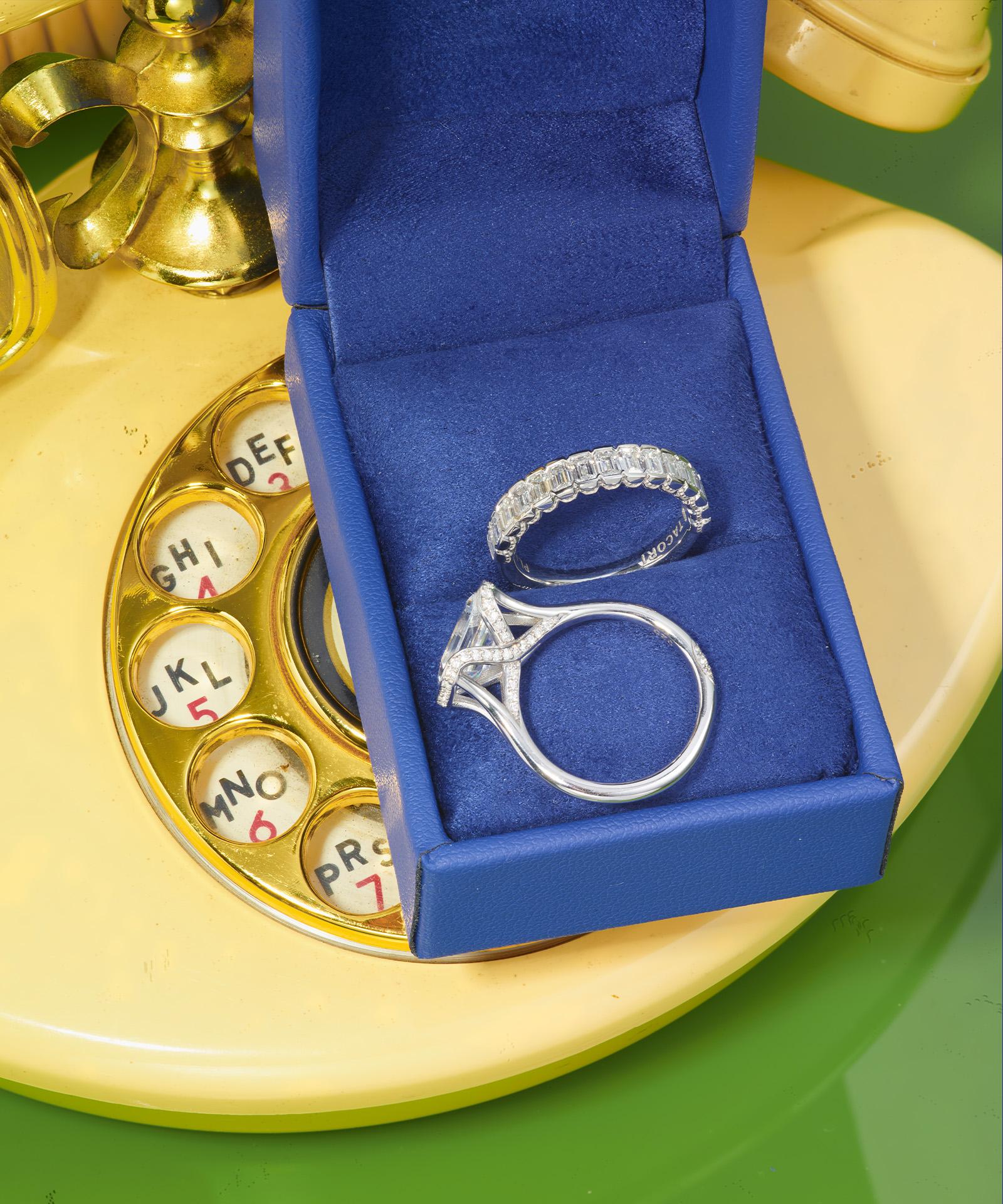 Two rings in box against yellow phone