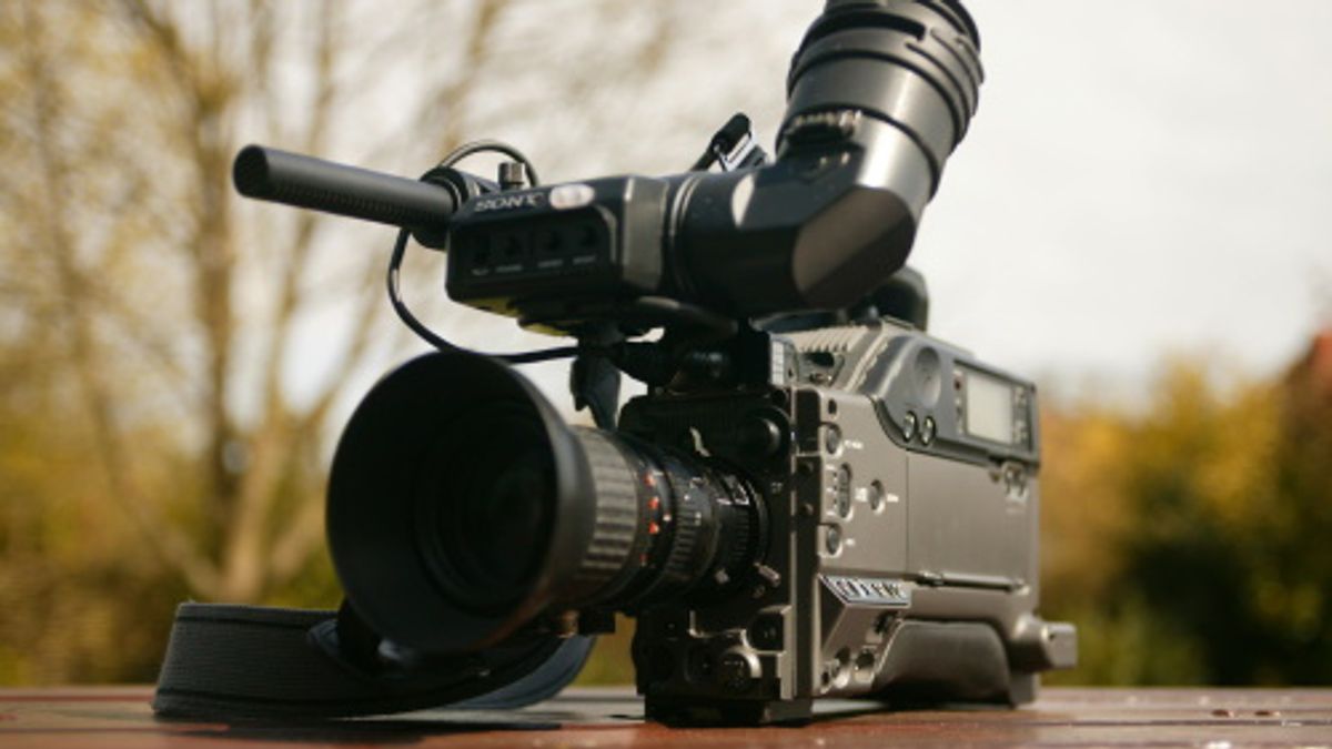 Stock image of a video camera on a table outside