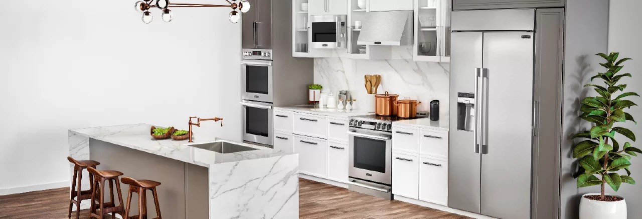 white kitchen with stainless steel appliances