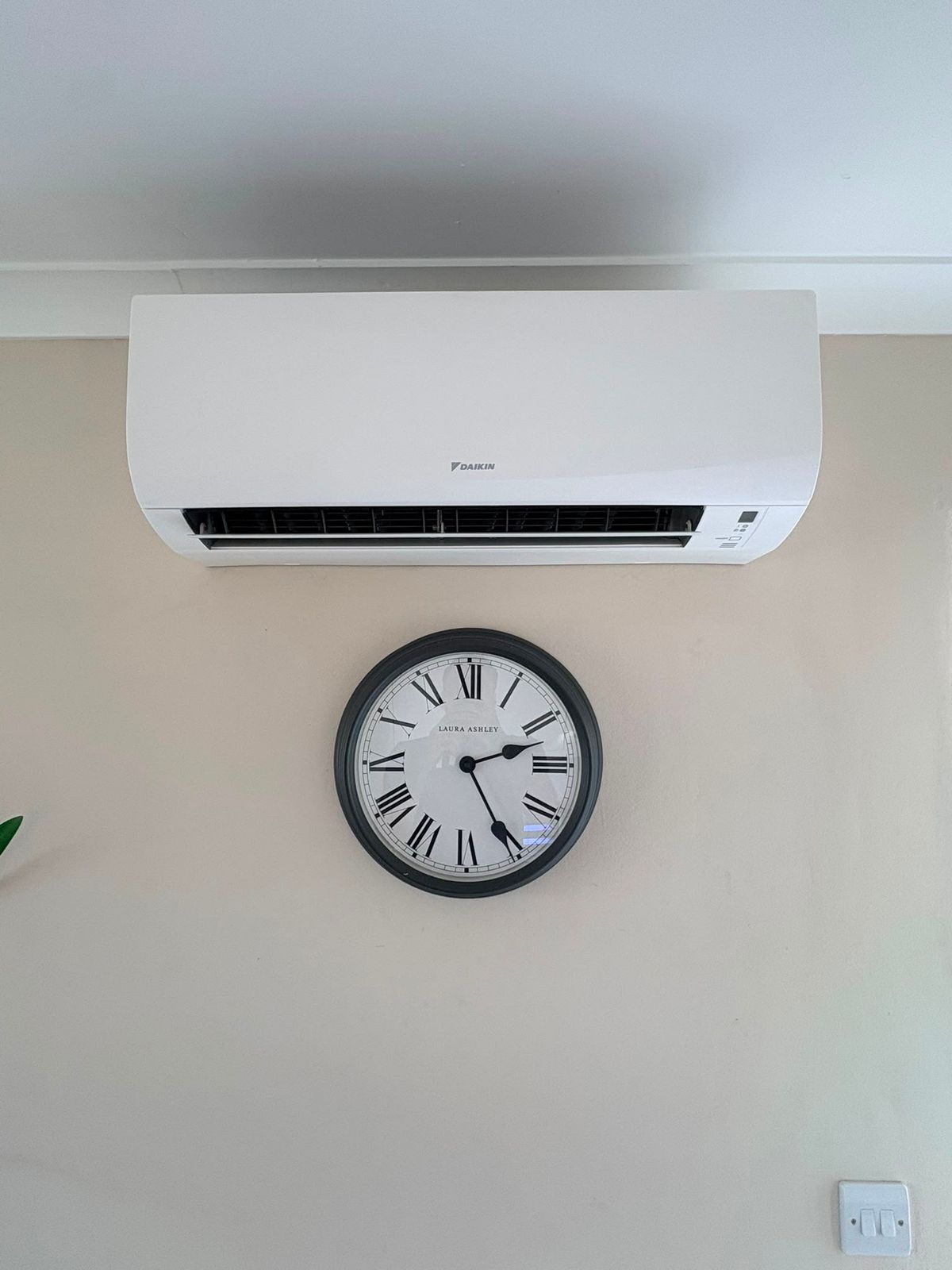 Daikin indoor unit sited high and centred on the wall