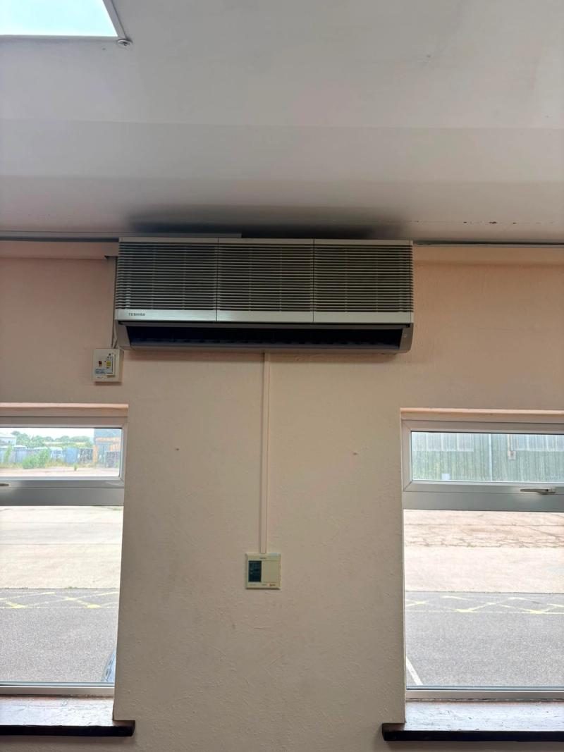 A 32 year old Toshiba wall mounted split unit with its original wired controller below