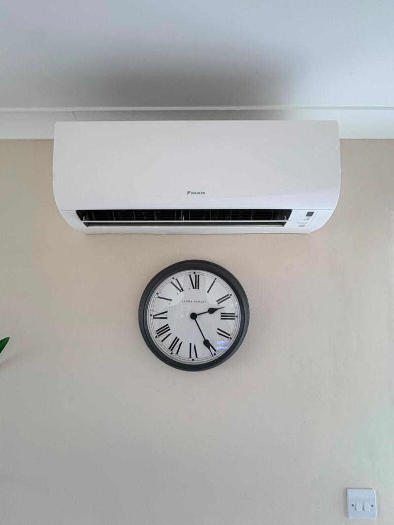Daikin wall mounted indoor unit installed in a domestic room with concealed pipework