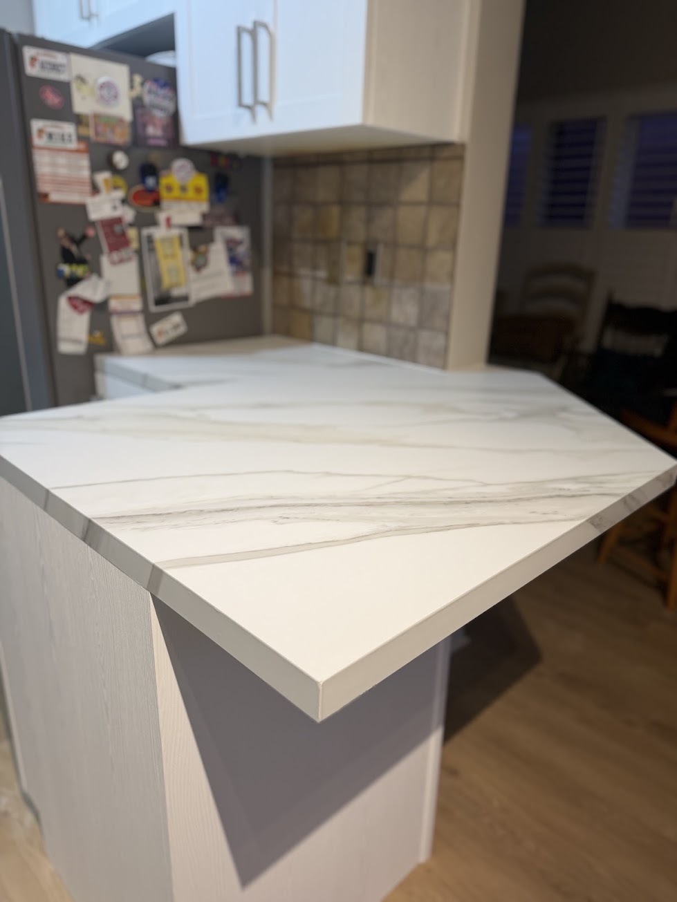 Calacatta marble vinyl wrapped kitchen peninsula