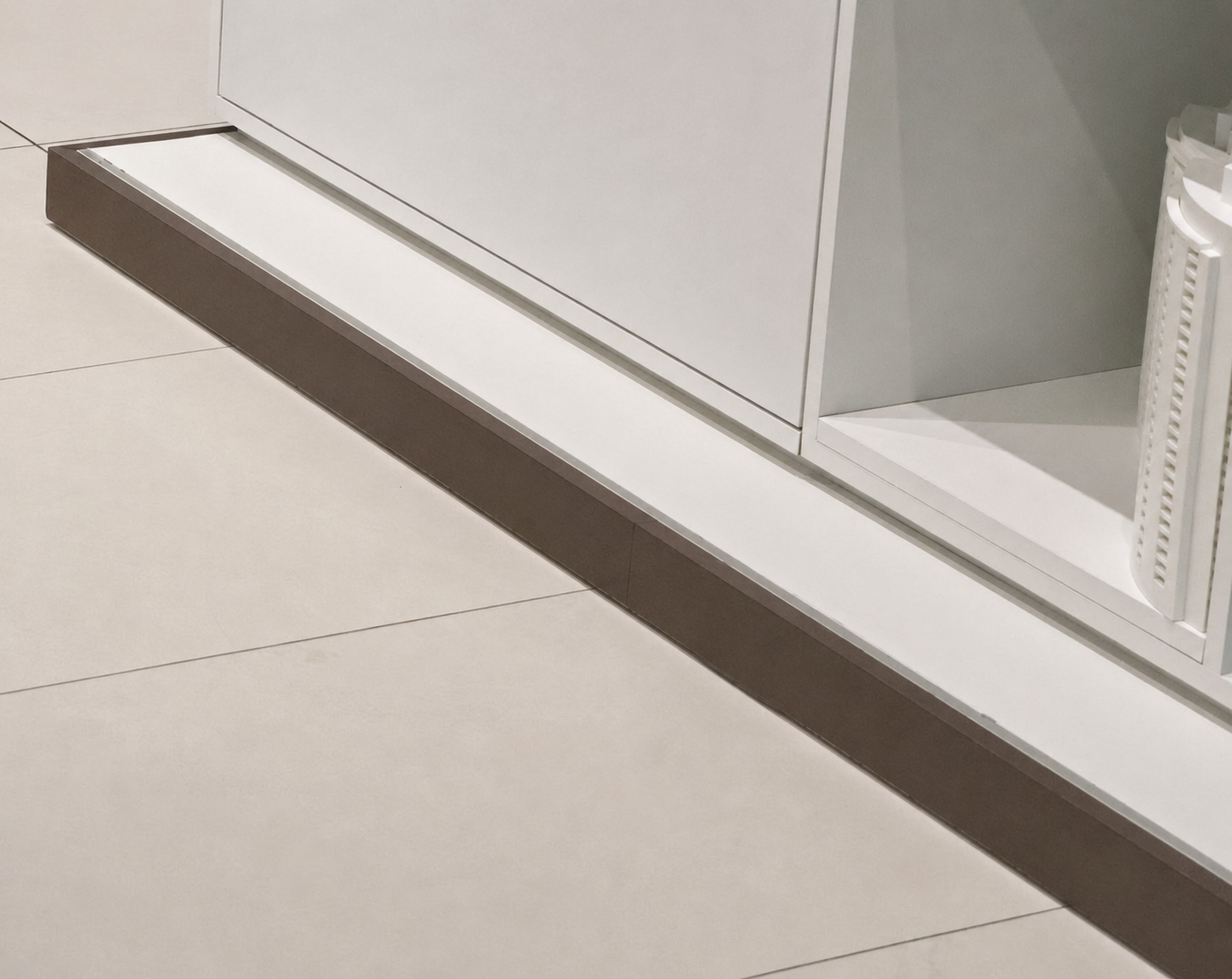 Bronze metallic wrapped baseboard trim detail