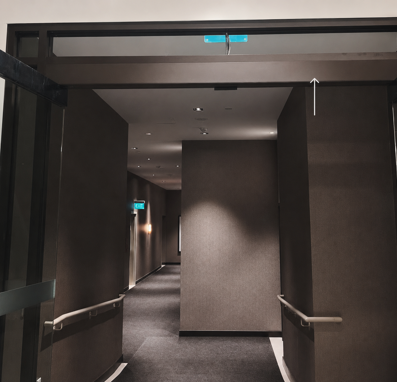 Dark hallway with wrapped walls and trim