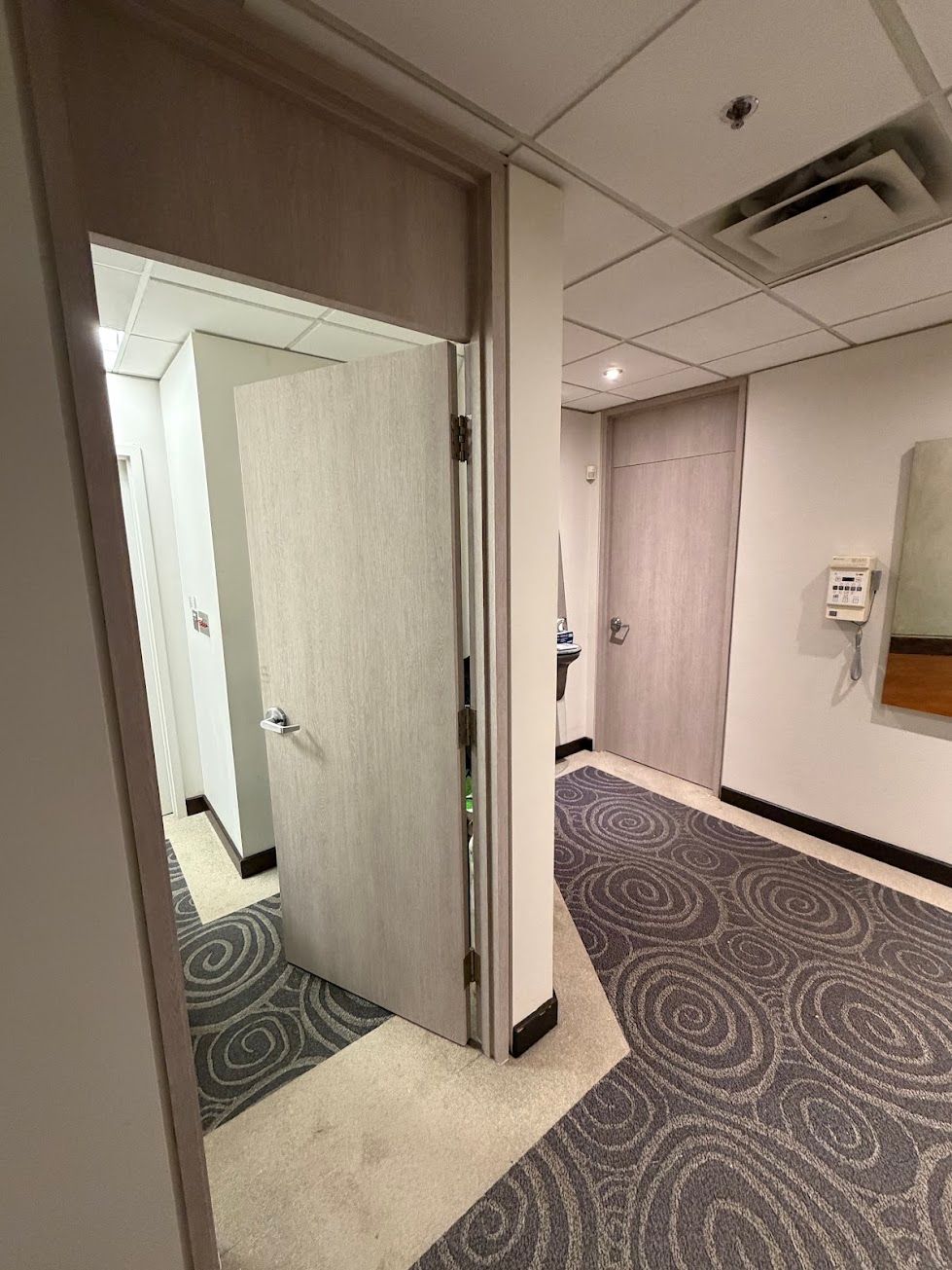 Light woodgrain vinyl-wrapped office doors