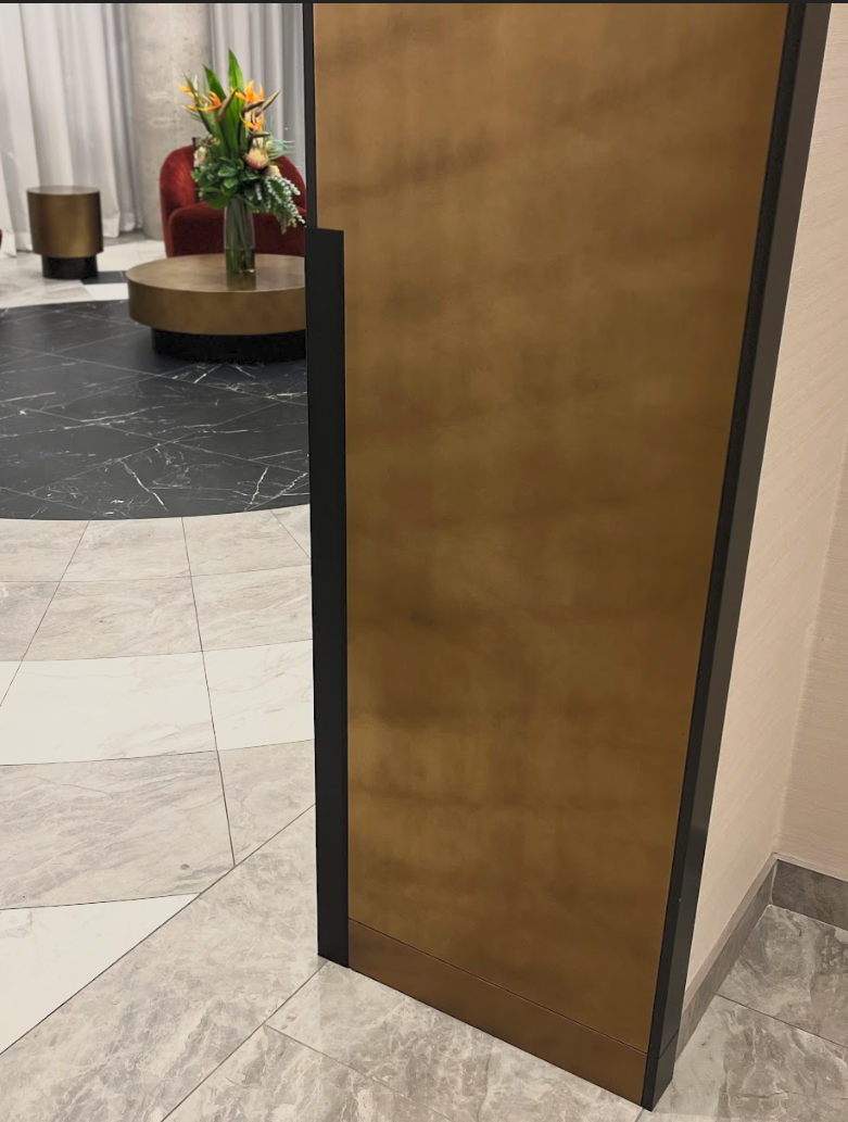 Custom millwork and reception desk resurfacing with architectural vinyl film