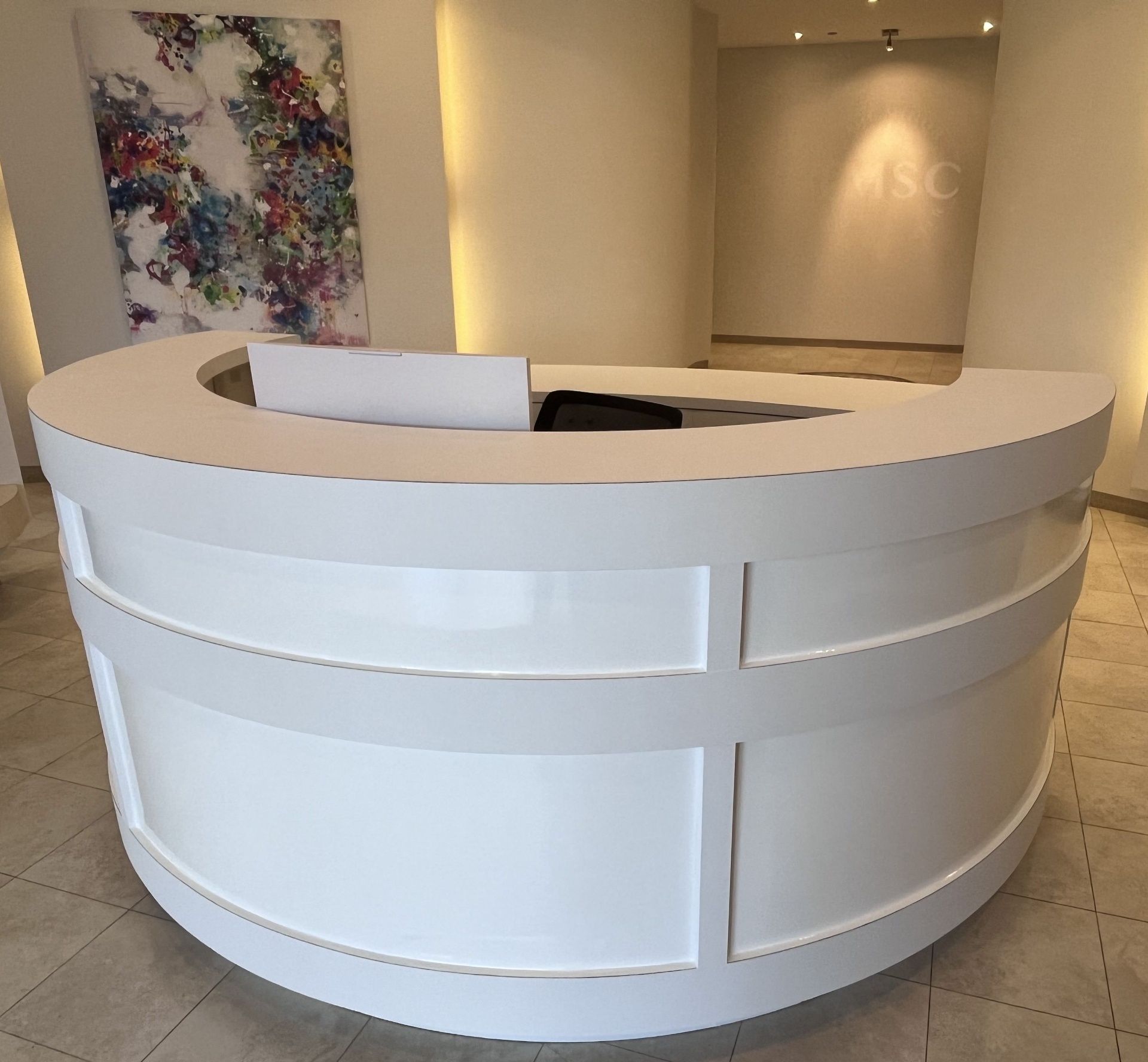 Reception desk and countertop vinyl wrap in a commercial lobby