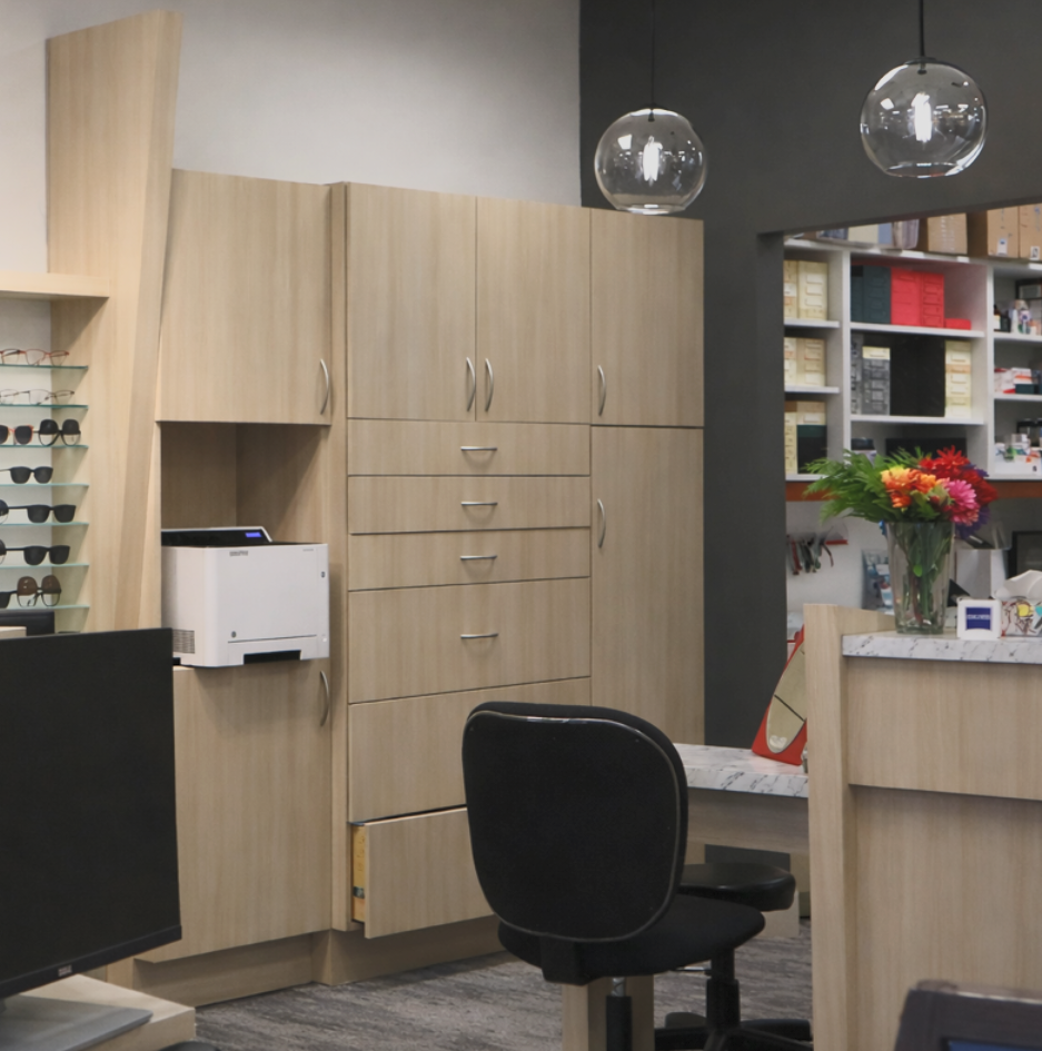 Light woodgrain vinyl-wrapped office casework