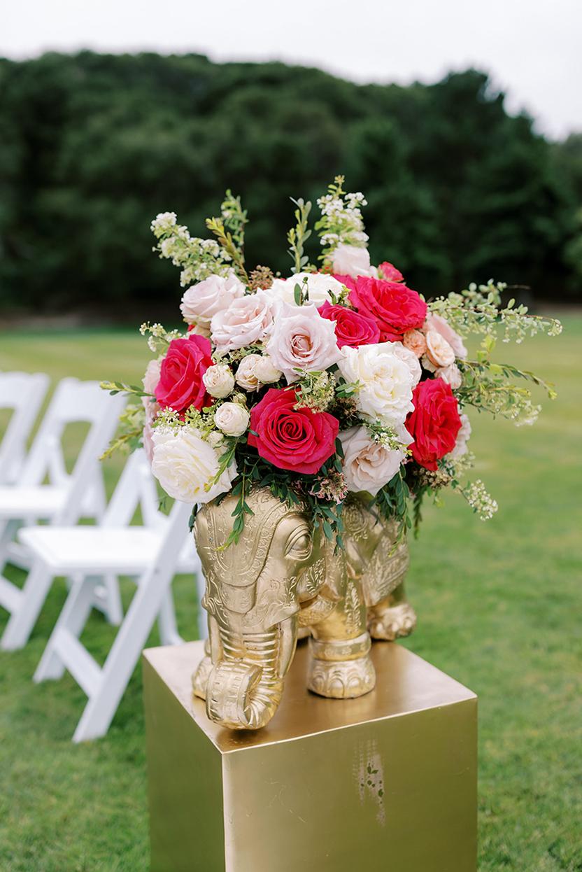 Pink and white bridal bouquet with red roses