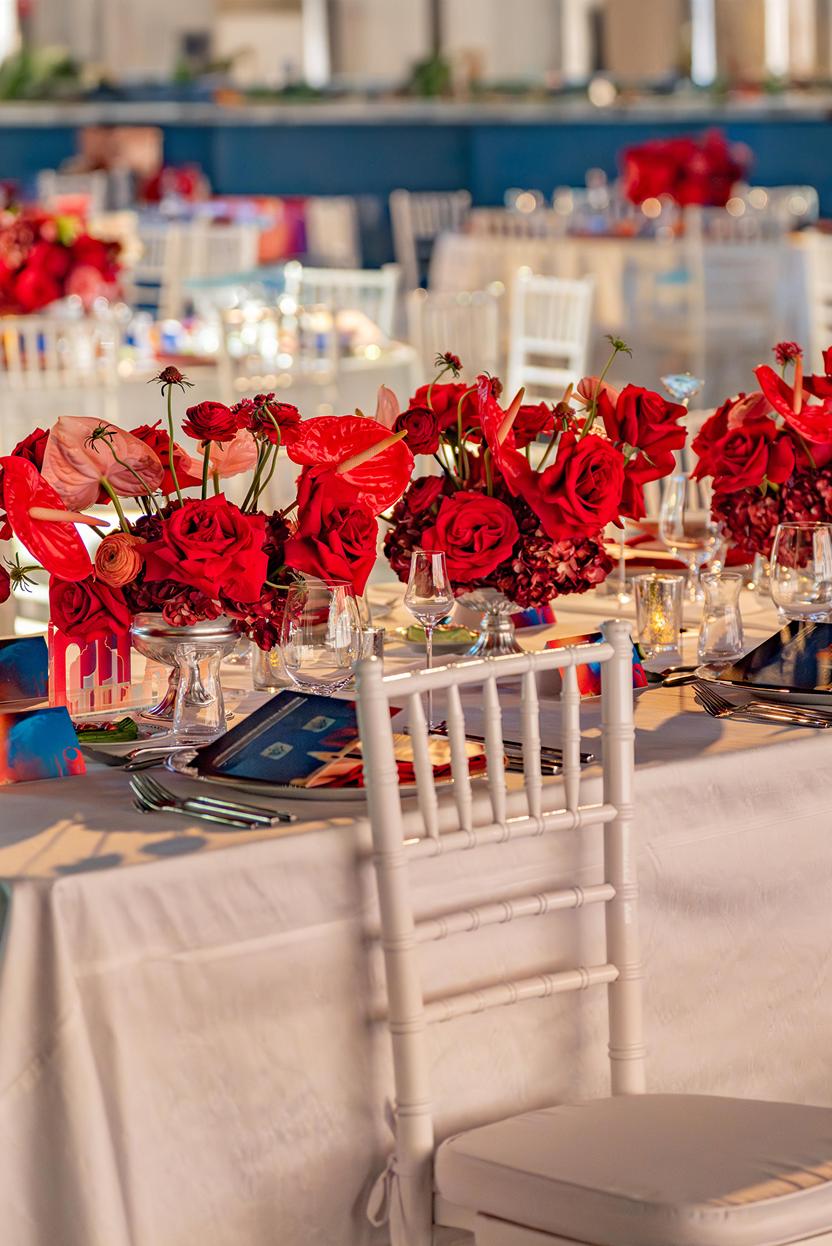 Red floral tablescape with glassware and place settings