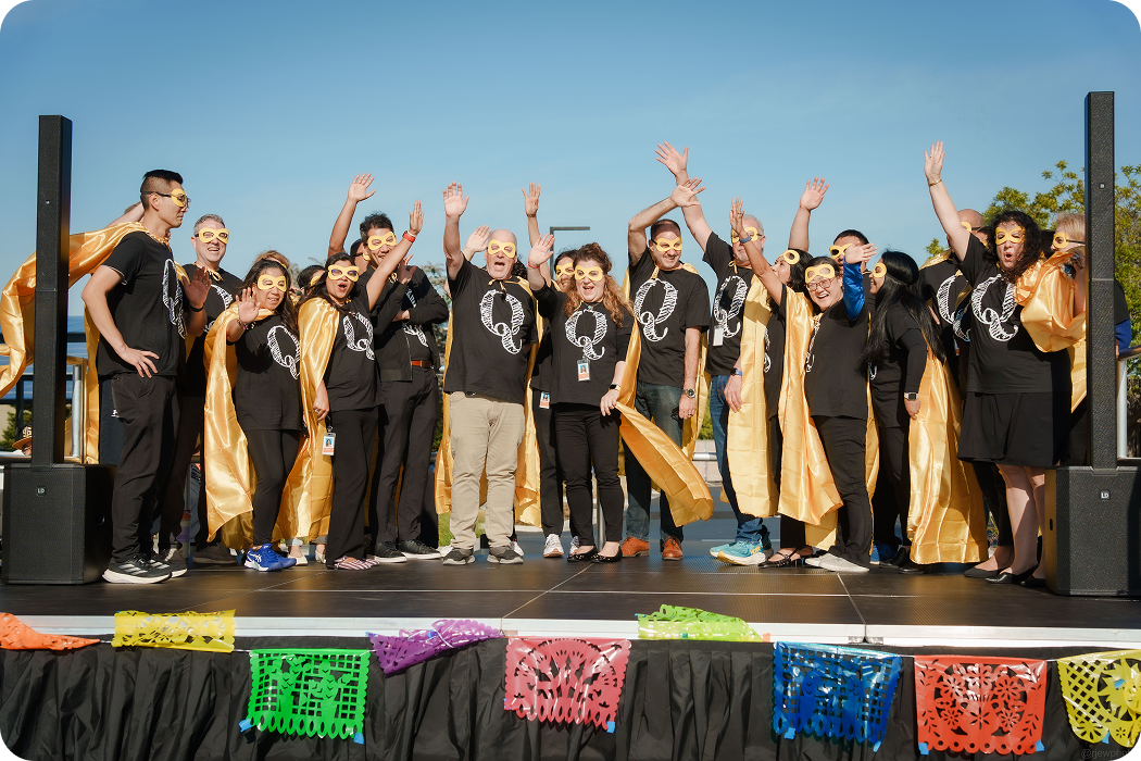 Team group celebrating together on stage