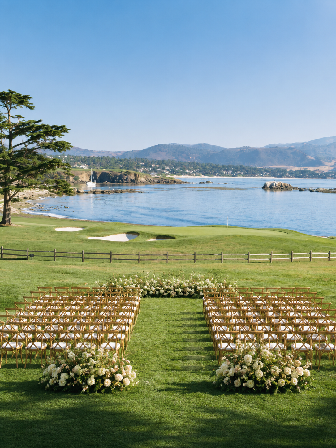 Lakeside outdoor wedding ceremony with floral arch