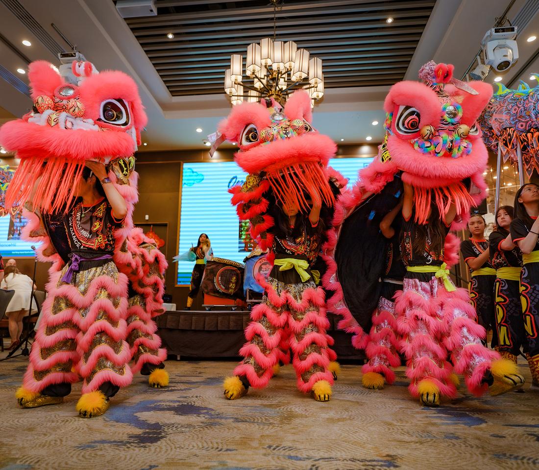 Lion dancers performing at a milestone celebration