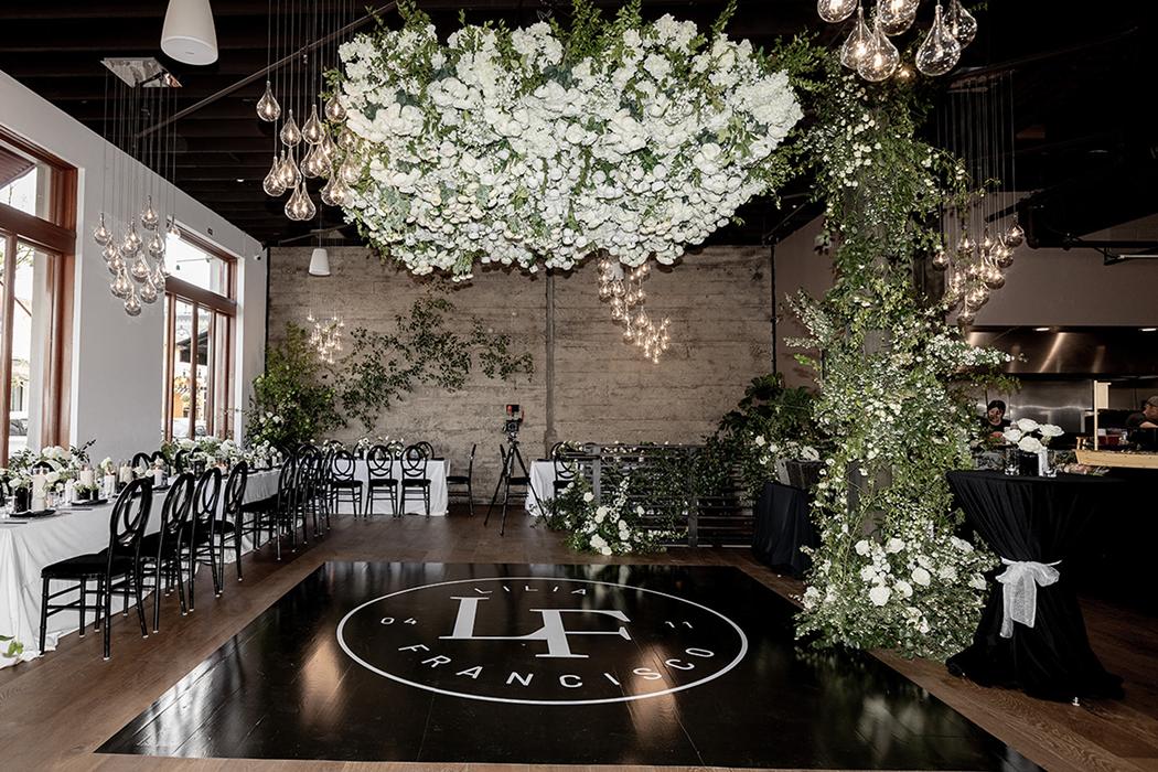 Floral installation over a dance floor in an event venue